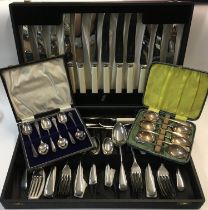 A collection of boxed cutlery sets.
