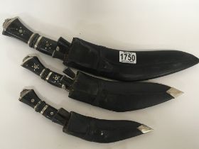 A set of three graduating Kukri Knifes with horn h