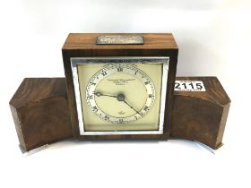 A 1930s Elliott walnut veneered mantle clock, sold