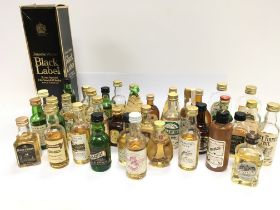 A collection of assorted whiskey miniatures and a