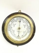 A brass barometer , postage category D- NO RESERVE