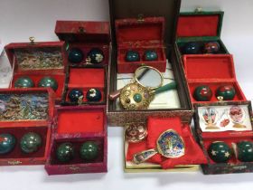 A collection of boxed Chinese and mirrors and stress balls. Shipping category D.