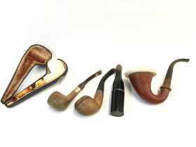 A small collection of smoking pipes. Postage B