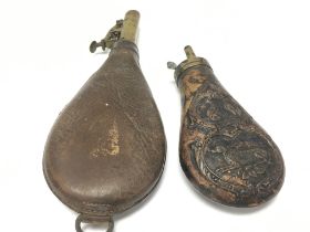 Powder flasks, one leather and one copper with ill