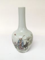 A Chinese bottle vase decorated with a figure of a