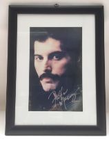 A framed and glazed photo signed by Freddie Mercur
