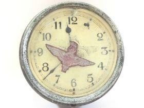 A vintage bakelite clock with a parachute regiment