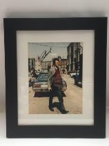 A framed and glazed signed photo of Clint Eastwood