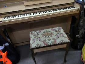 A Kemble Minx satin birch mini piano of Art Deco design with a matching stool.