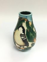 A small Moorcroft vase depicting coal tits, approx