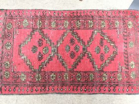 Red hand knotted door mat dimensions 88x50cm. Postage category C