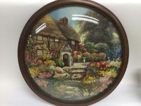 A circular three dimensional oil painting housed i