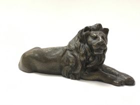 A bronze lion figure , 8cm tall. Postage category