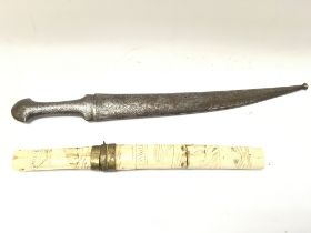 A Chinese engraved bone scabbard dagger and a Pers