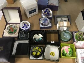 A collection of paperweights including Caithness