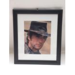 A framed and glazed signed photo of Clint Eastwood