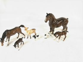 A collection of Beswick and Doulton animal figures