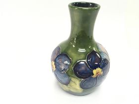 A small Moorcroft vase 13cm tall. Good condition.