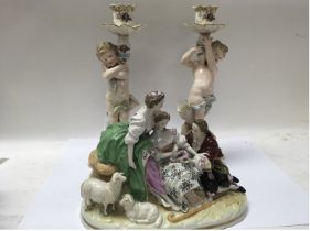 German porcelain figure group with a pair of figur