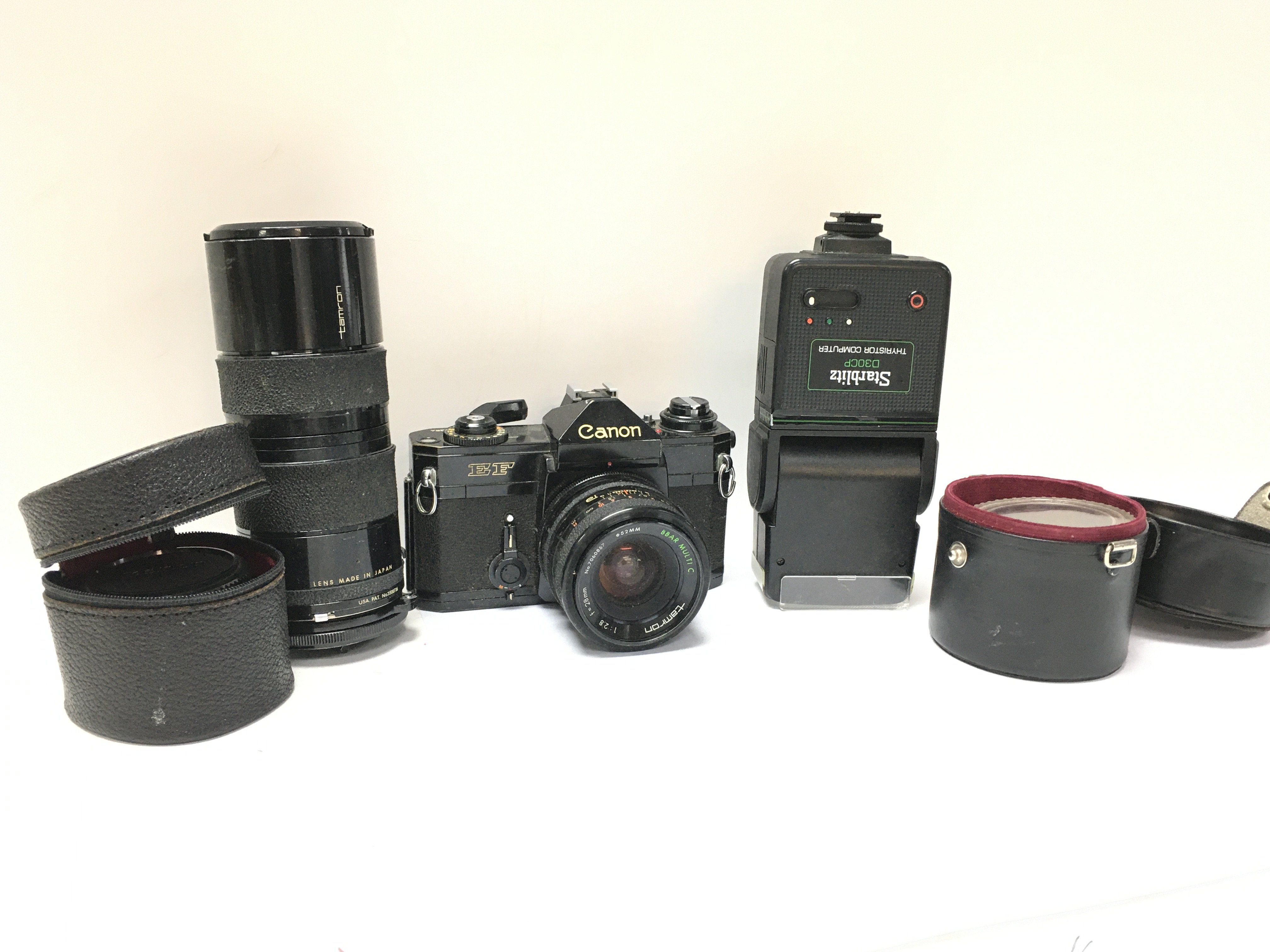 A vintage canon EF camera with lens. Postage categ