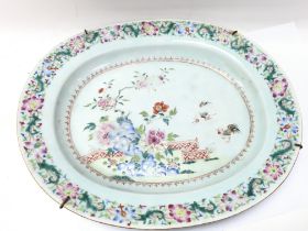 A Chinese Famille Rose style dish decorated with f