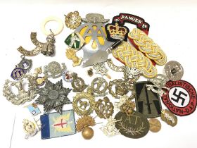 A Collection of military and other badges includin