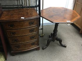 A small walnut bow fronted set of drawers fitted w