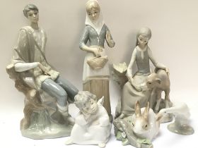 A collection of Lladro And Valencia porcelain figu