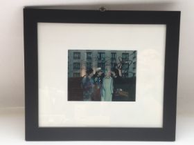 A framed and glazed signed photo of The Rolling St