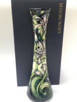 A boxed Moorcroft vase in the Isis pattern designe
