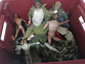 A collection of Vintage Action Man figures and clo