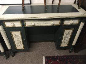 A painted wood side table with drawers and cupboar