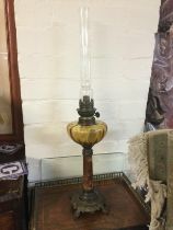 An onyx and metal oil lamp. Shipping category D.