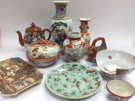 A box of Oriental ceramics including a teapot, vas