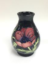 A small Moorcroft anemone vase of baluster form, a