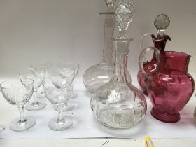 A collection of cut glassware including decanters,