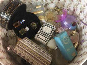 A hatbox containing a collection of perfume bottle