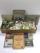 A box of mixed cigarette cards including Churchman