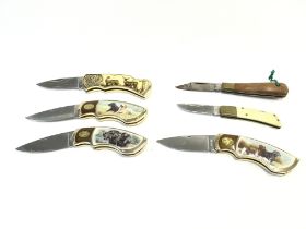 A collection of assorted pen knives.