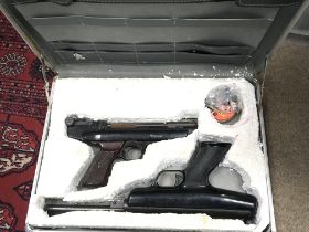 Cased vintage air pistols including a BSA scorpion
