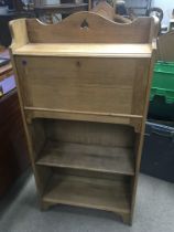 An Arts and Crafts style light oak bureau bookcase