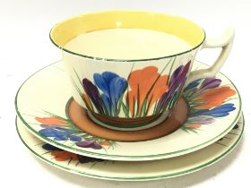 A Clarice Cliff Big Anne cup and saucers, postage
