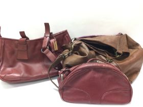 A collection of leather handbags including Losetti