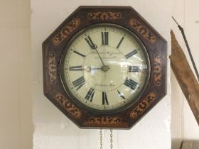 A drop dial inlaid octagonal wall clock with weigh