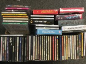 A box of CDs by various artists including Buddy Ho