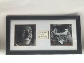 A framed and glazed signed photographic display of