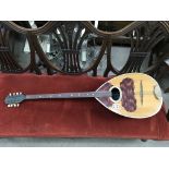 A vintage long necked mandolin, 97cm.