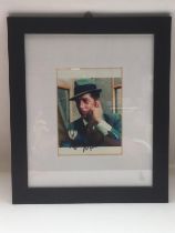 A framed and glazed signed photo of Dean Martin, a