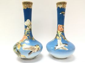 Oriental vases decorated with cherry blossom and b