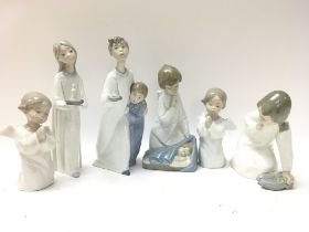 A collection of porcelain Lladro Children figurine